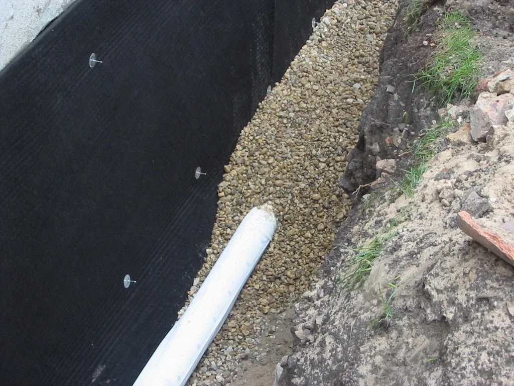 Exterior foundation waterproofing membrane and drain tile